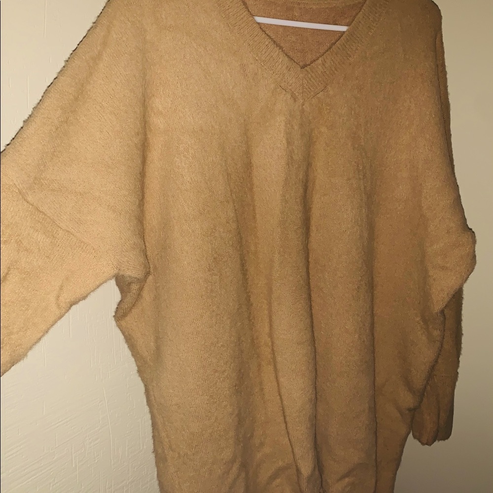 Cashmere sweater over the hip length